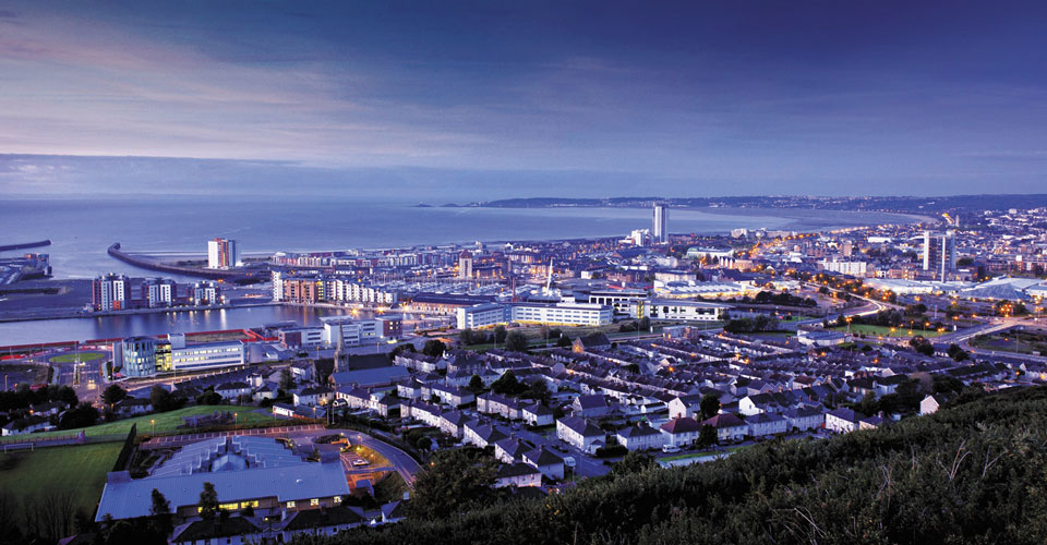 swansea city skyline showing properties in mumbles, marina and sanfields
